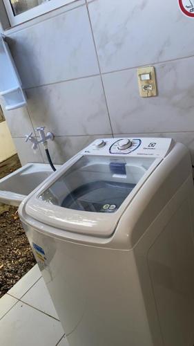 a toilet with its seat up in a bathroom at Mandakaru Residence Flat da Isa 01 in Porto De Galinhas