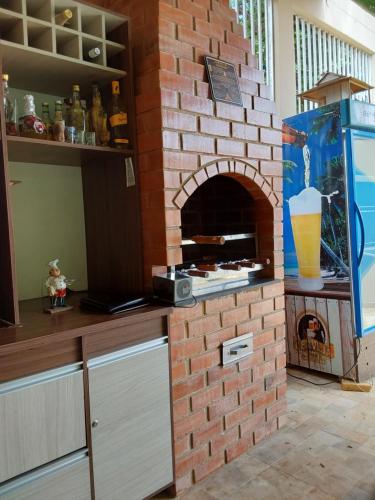 a brick oven in the middle of a kitchen at Casa de temporada Petrolina-PE in Petrolina