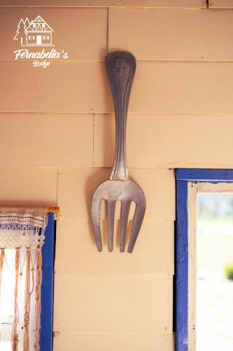 a fork hanging on the side of a wall at Fernabella's Lodge in Valle de Guadalupe