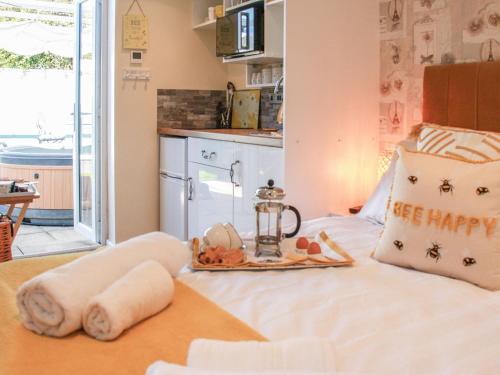 a bedroom with a bed with a happy birthday pillow at The Beehive in Mundesley