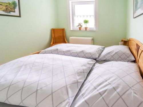 two beds sitting next to each other in a bedroom at Family Stay in Suhl Forest in Suhl
