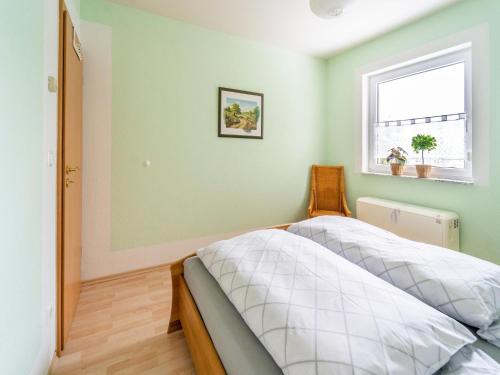 a bedroom with two beds and a window at Family Stay in Suhl Forest in Suhl