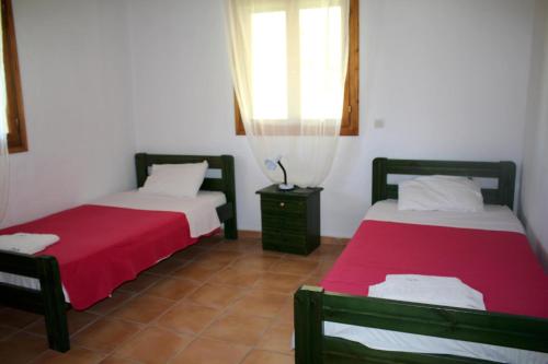 Ένα ή περισσότερα κρεβάτια σε δωμάτιο στο Nikos Kastro 4