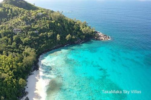 an aerial view of a beach and the ocean at Takamakasky Villas in Takamaka