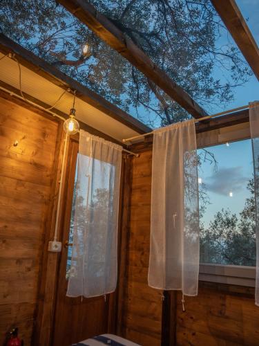 a room with a window with a curtain at Agriturismo S.Ilario in Genova