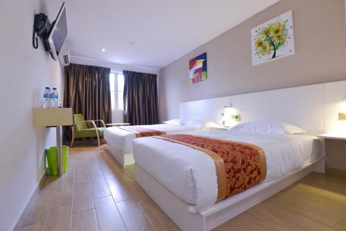 Voodi või voodid majutusasutuse Hotel Pintar toas