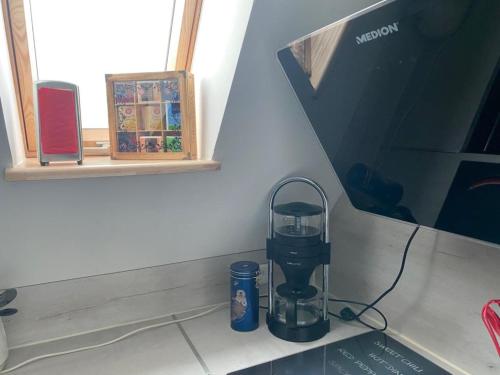 Příslušenství pro přípravu čaje a kávy v ubytování Ferienwohnung Ipsheim Zentral