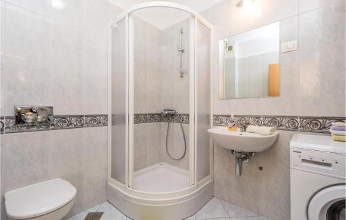 a bathroom with a shower and a toilet and a sink at 3 Bedroom Gorgeous Apartment In Kastav in Kastav