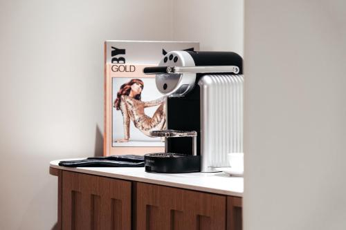 a mixer sitting on top of a kitchen counter at Padam Hôtel in Paris