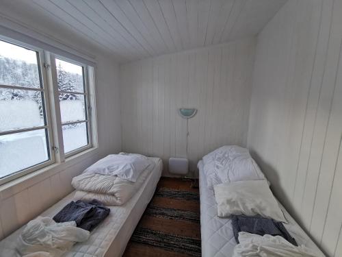 Ένα ή περισσότερα κρεβάτια σε δωμάτιο στο Tangen - cabin with 4 bedrooms - great nature