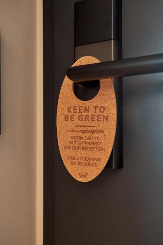 a sign on a door that reads keep to green at Cocoon Sendlinger Tor in Munich