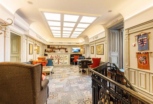 a living room filled with furniture and a skylight at Hotel Natalia 18 in Lviv