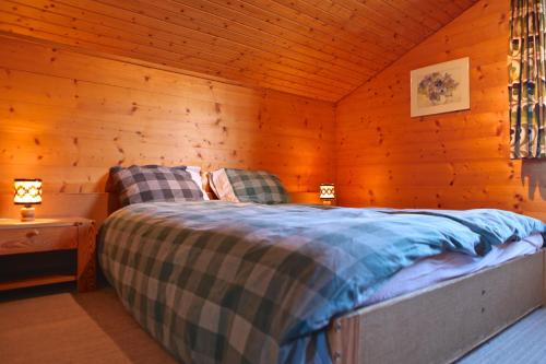 Postel nebo postele na pokoji v ubytování Chalet Arabesque - Switzerland