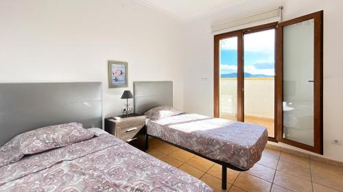 Postel nebo postele na pokoji v ubytování Villa El Palmar 2 en Denia