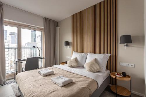 Posteľ alebo postele v izbe v ubytovaní Mennica Residence Deluxe