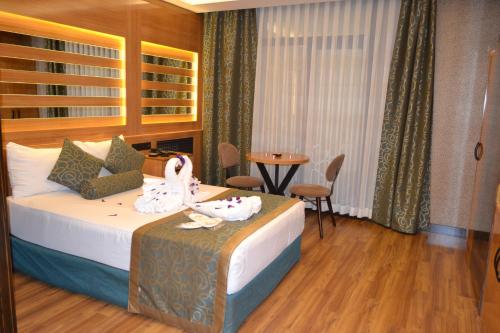Katil atau katil-katil dalam bilik di Gumus Palace Suites