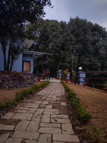 a stone path in front of a house at Bajoon homestay in Bhīm Tāl