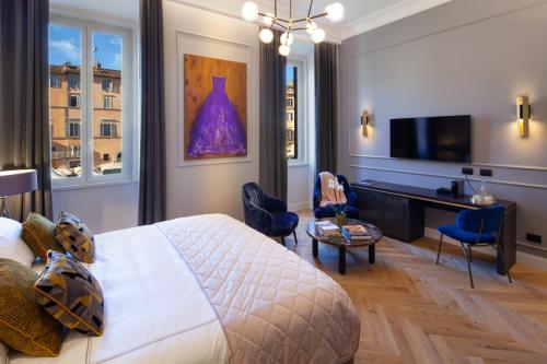 Una televisión o centro de entretenimiento en Migliori Collection Piazza Navona
