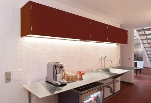 a kitchen with a mixer on a counter top at Højhuset Kulturhotel in Herning