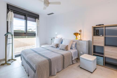 A bed or beds in a room at Apartamento Nuba A