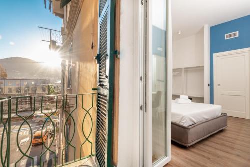 Posteľ alebo postele v izbe v ubytovaní Nelli Rooms Via Biassa