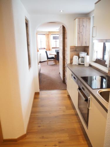 a kitchen with a sink and a counter top at Almhof-Reithof Pitztal in Sankt Leonhard im Pitztal