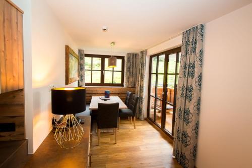 a dining room with a table and chairs at Almhof-Reithof Pitztal in Sankt Leonhard im Pitztal