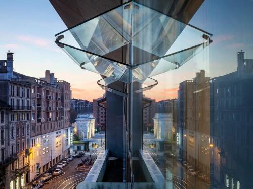 a view of a city with a glass building at Business & Luxury Suite - Montè16 in Milan