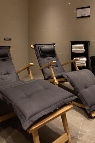 two massage chairs sitting in a room at The More Hotel Lund in Lund