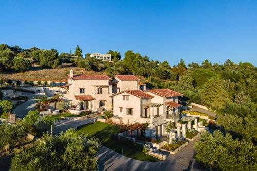 an aerial view of a large house on a hill at Kastri Elia Suites in Nikiti