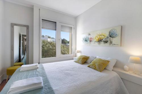 Ένα ή περισσότερα κρεβάτια σε δωμάτιο στο Apartamento T1 - Tróia Resort