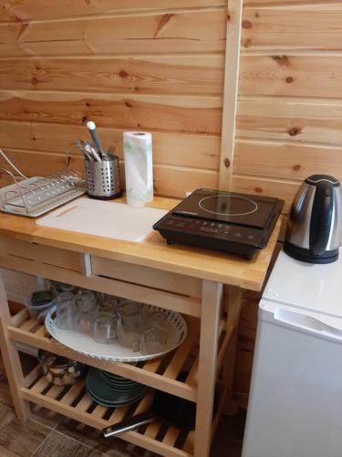 a wooden desk with a computer on top of it at Domek dla par agroturystyka siedlisko 