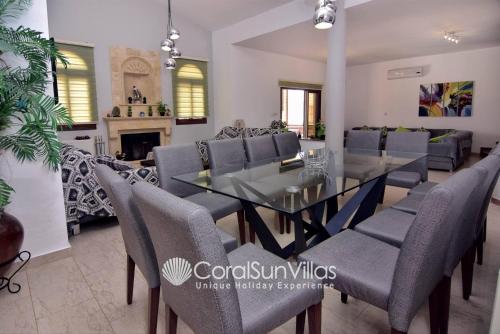 a dining room with a table and chairs at Elegant Huge Villa Large Pool, Ideal For Weddings in Kathikas