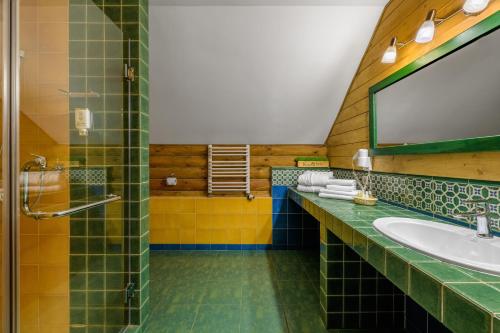a bathroom with a sink and a mirror at Kryve Ozero in Novoyavorivsk