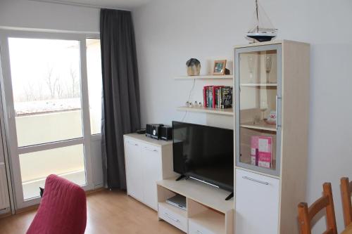 TV/Unterhaltungsangebot in der Unterkunft Ferienappartement K118 in Strandnähe