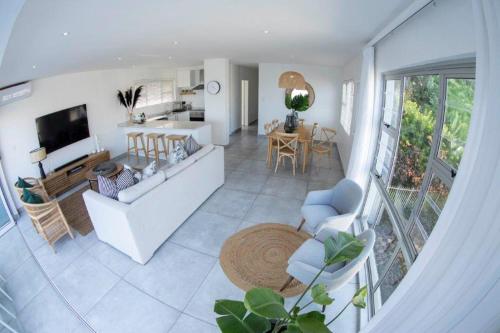 a living room and kitchen with a view of a living room at 20 Marginella with inverter in Umdloti