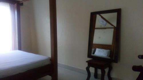 A bed or beds in a room at KITWE PEMBENI APARTMENTS