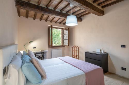 Postel nebo postele na pokoji v ubytování Pulciano Apartments