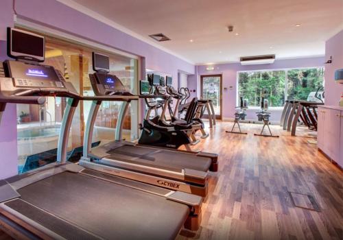 a gym with treadmills and a treadmill at Kingsmills Hotel in Inverness