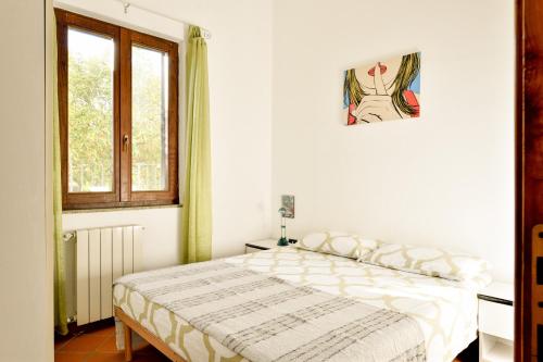 Кровать или кровати в номере Il giardino vista mare