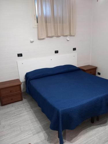 Giường trong phòng chung tại Mondello Seminterrati Cavarretta