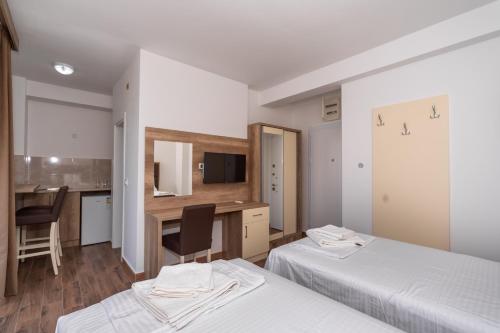 Una cama o camas en una habitación de Hotel Pharos