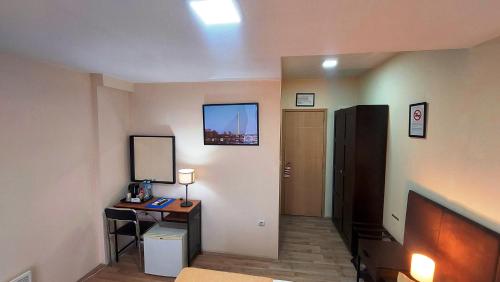a room with a hallway with a desk and a mirror at Hotel Villa Panorama in Belgrade