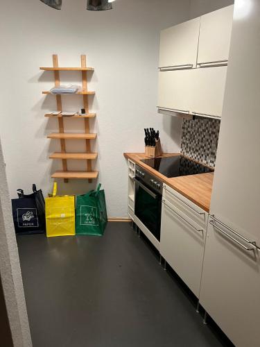 a kitchen with a sink and a stove top oven at Monteurwohnung Karlsruhe - L8 Street in Karlsruhe