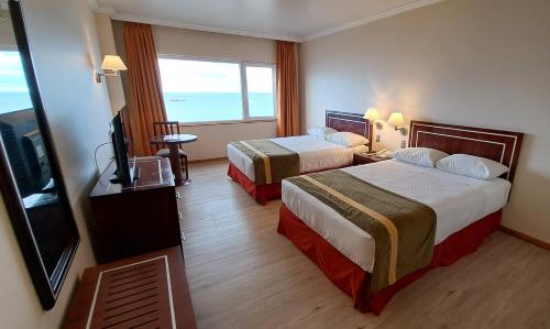 Postel nebo postele na pokoji v ubytování Hotel Diego de Almagro Punta Arenas