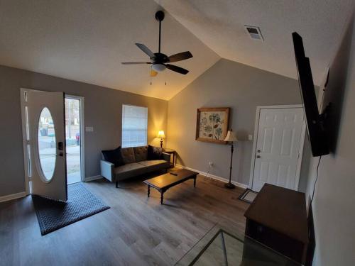 a living room with a couch and a ceiling fan at Perfect Place for Families in Hernando