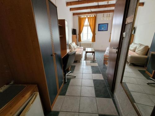 a room with a hallway with a living room at Hotel Koruna in Jeseník