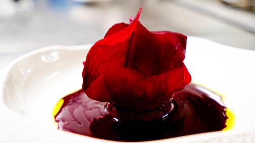 a blob of red sauce on a white plate at Boutique Logis Hôtel Relais de Vincey in Vincey