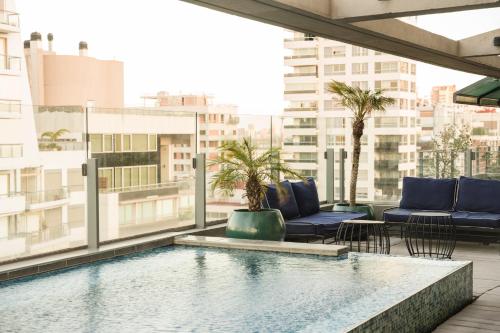 a swimming pool on the roof of a building at Urbanica The Libertador Hotel in Buenos Aires
