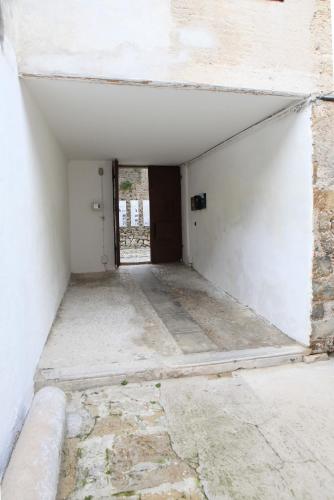 an empty room with a door in a building at Monastero Maggiore 1 in Cividale del Friuli
